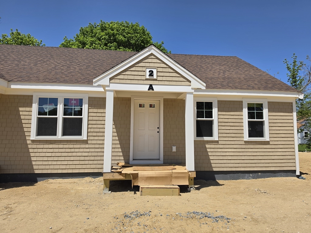 87 Acapesket Road, Unit 2A Falmouth, MA 02536 - Photo 5 of 17 a view of a house with a yard