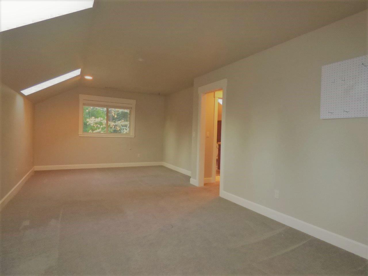 2144 Southwest Allen Creek Road Grants Pass, OR 97527 - Photo 35 of 55 2nd Master Bedroom Upstairs. Skylights and windows bring in natural light. Lots of room for big furniture.