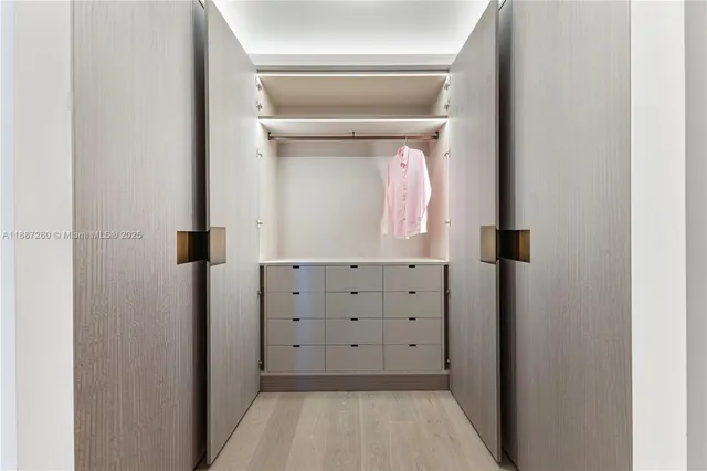 a view of a terrace with a floor to ceiling window and wooden floor