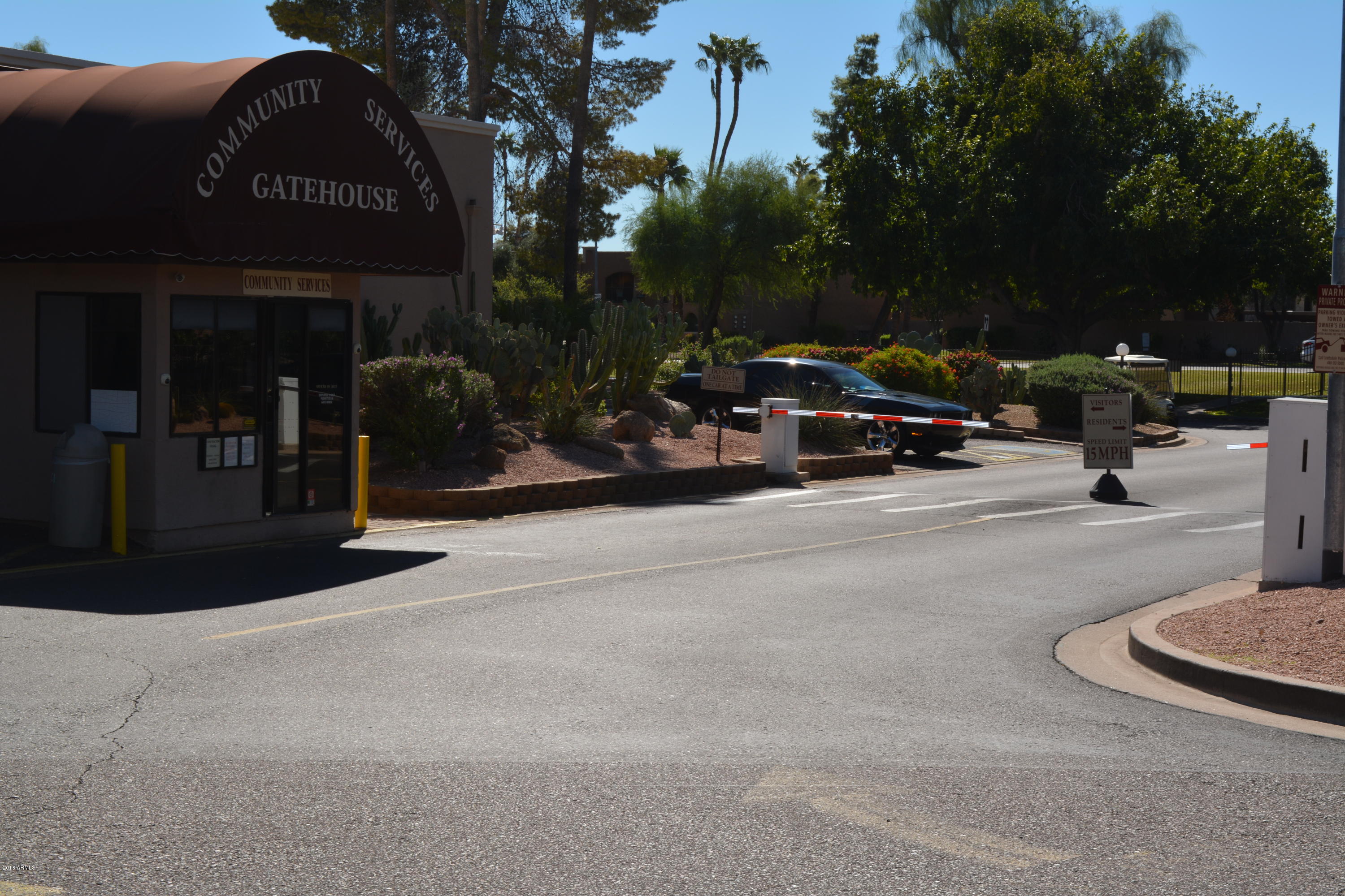 7870 East Camelback Road, Unit 412 Scottsdale, AZ 85251 - Photo 13 of 15 a view of street with parked cars