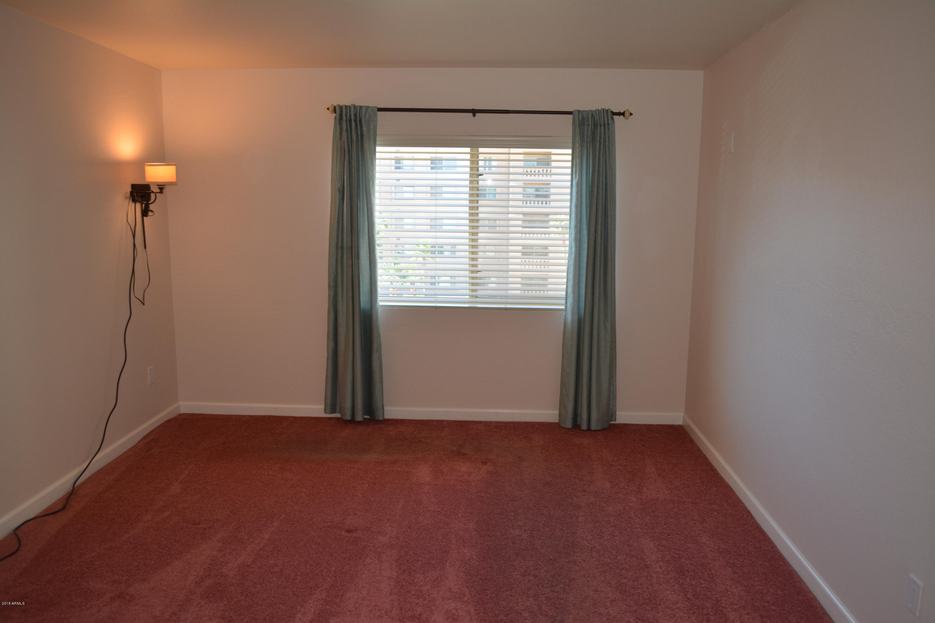 7870 East Camelback Road, Unit 412 Scottsdale, AZ 85251 - Photo 9 of 15 a view of an empty room with a window