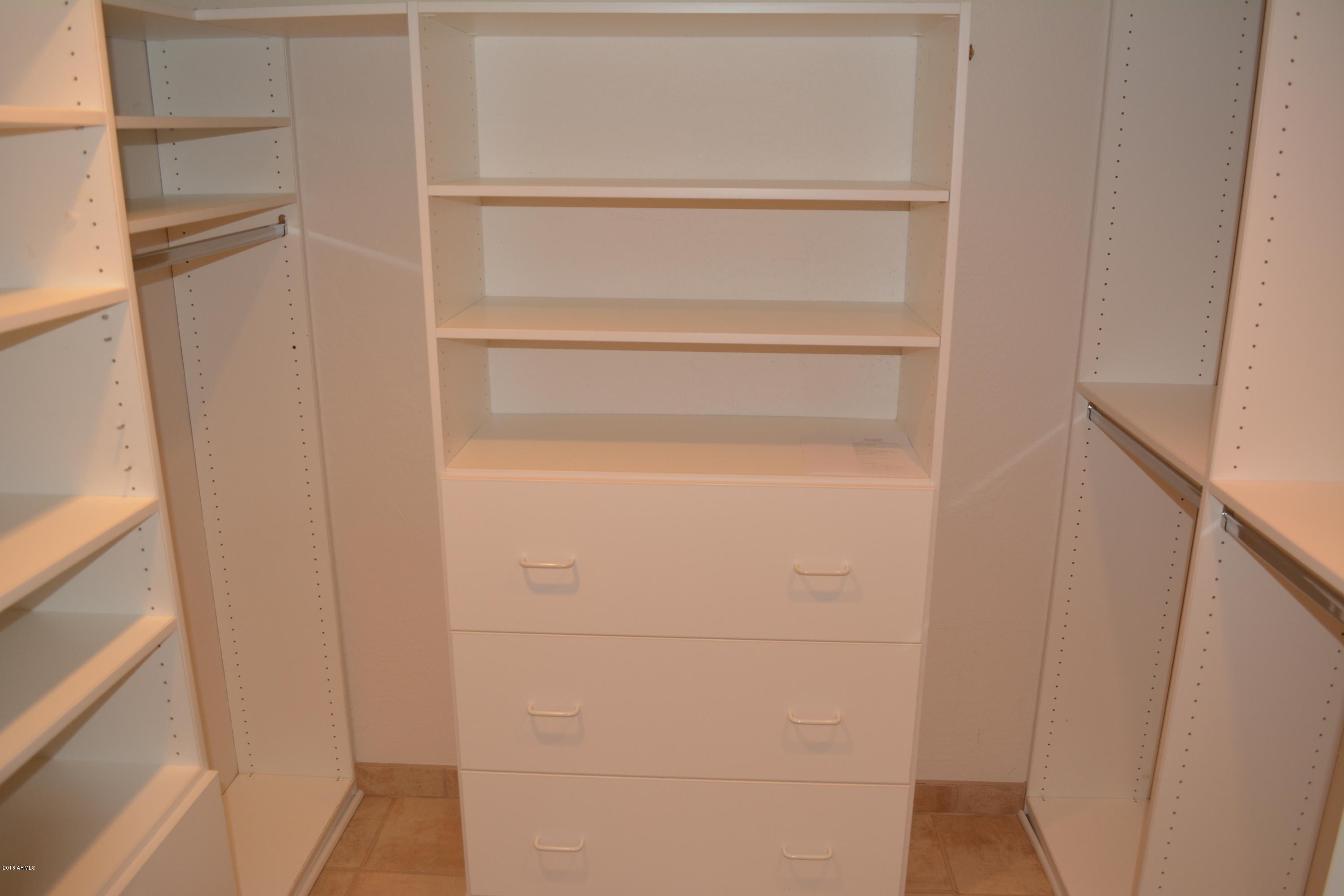7870 East Camelback Road, Unit 412 Scottsdale, AZ 85251 - Photo 10 of 15 a view of an empty walk in closet