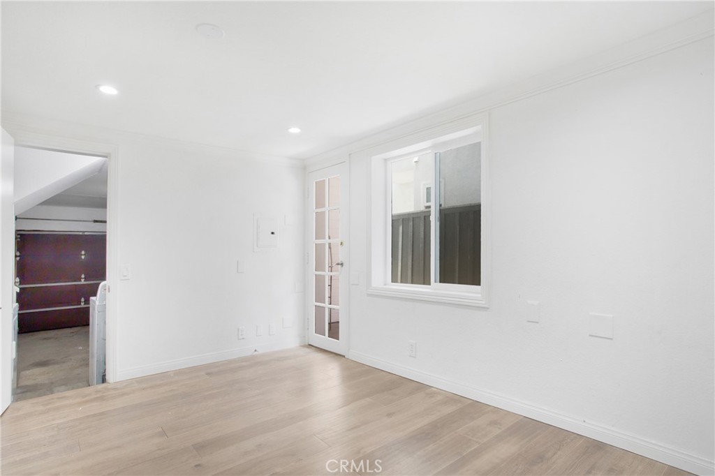 127 40th Street Manhattan Beach, CA 90266 - Photo 21 of 29 an empty room with wooden floor and windows