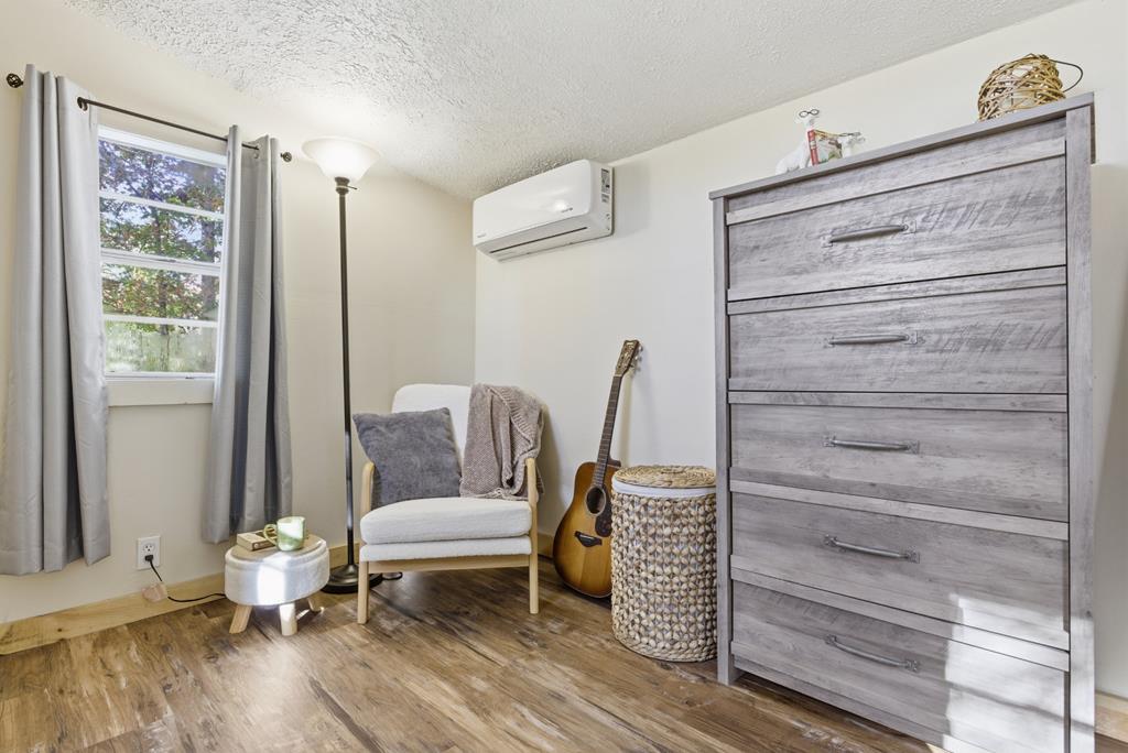 5240 Squirrel Hunting Road Blairsville, GA 30512 - Photo 19 of 40 a living room with furniture and wooden floor