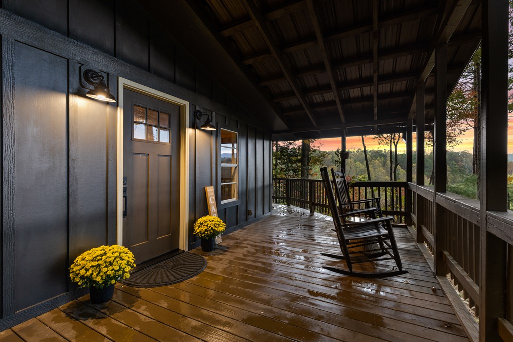 5240 Squirrel Hunting Road Blairsville, GA 30512 - Photo 23 of 40 a view of a balcony with dining area