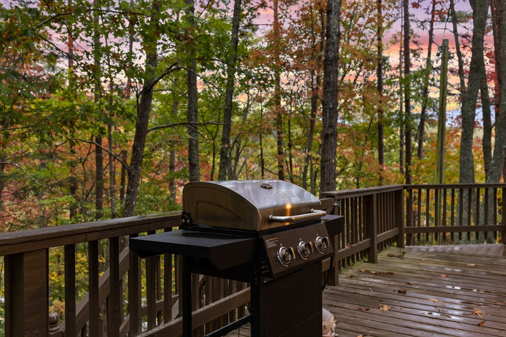 5240 Squirrel Hunting Road Blairsville, GA 30512 - Photo 26 of 40 a view of a deck with wooden floor and fence