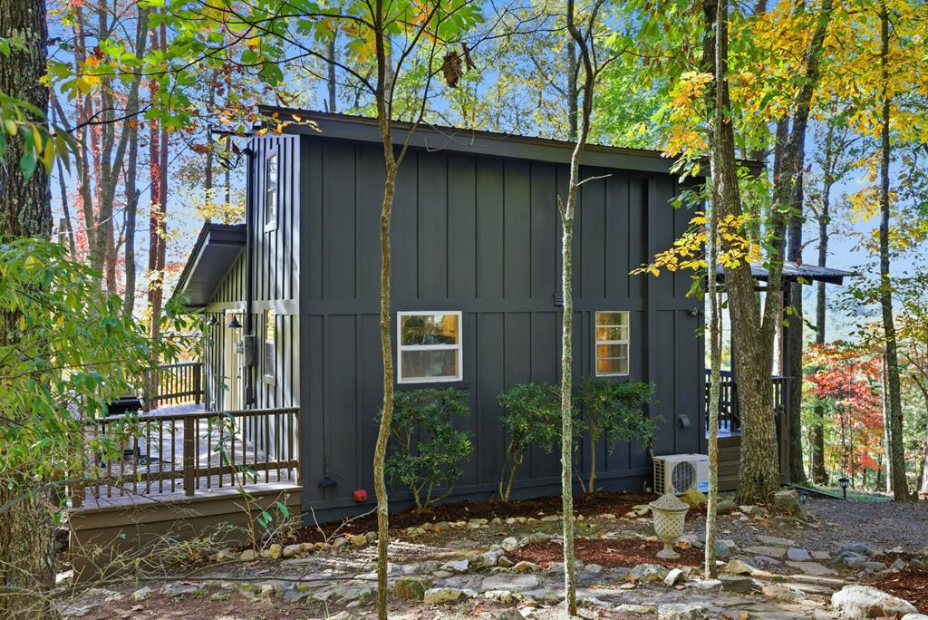 5240 Squirrel Hunting Road Blairsville, GA 30512 - Photo 30 of 40 a view of a house with a porch and furniture