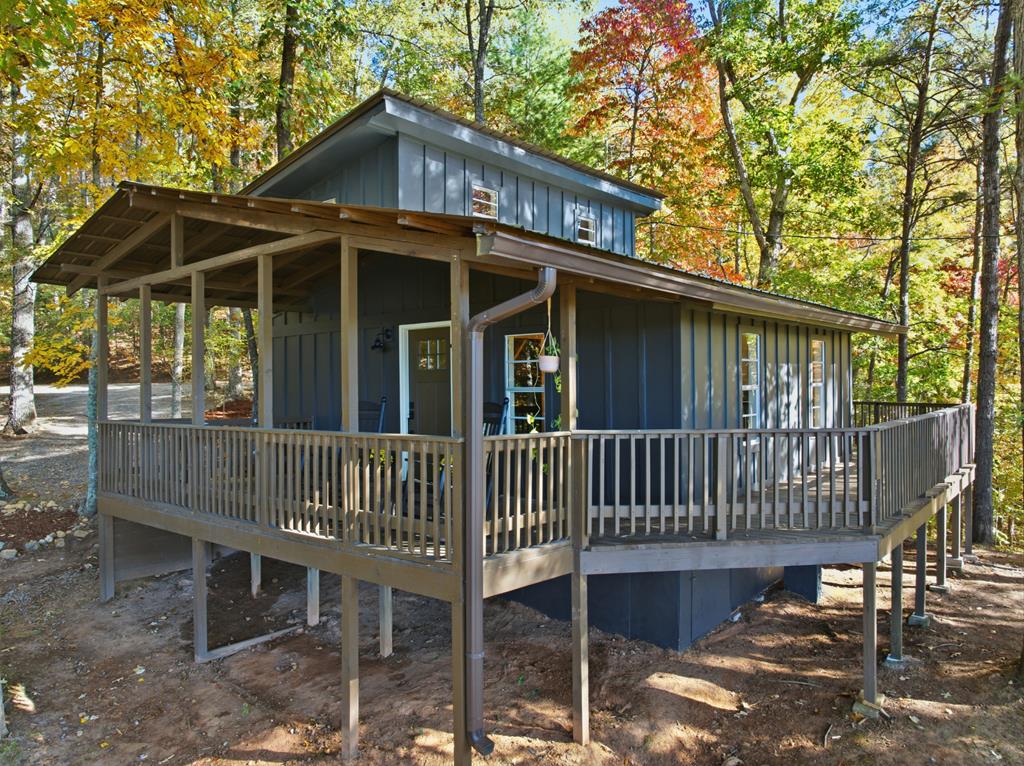 5240 Squirrel Hunting Road Blairsville, GA 30512 - Photo 3 of 40 a view of a chair and table in the deck