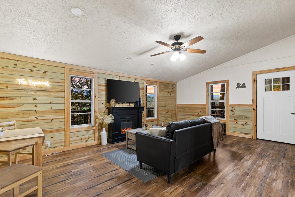 5240 Squirrel Hunting Road Blairsville, GA 30512 - Photo 34 of 40 a living room with furniture flat screen tv and wooden floor