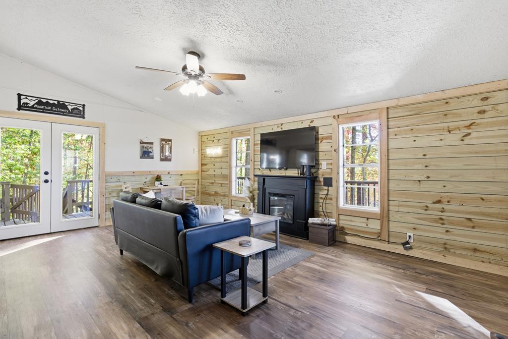 5240 Squirrel Hunting Road Blairsville, GA 30512 - Photo 8 of 40 a living room with furniture a fireplace and a flat screen tv