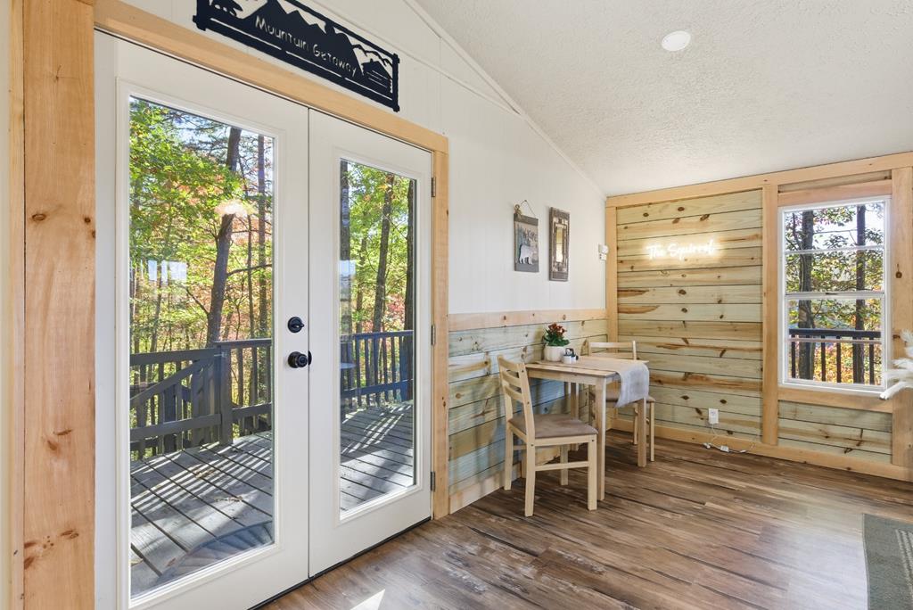 5240 Squirrel Hunting Road Blairsville, GA 30512 - Photo 10 of 40 a view of a dining room with furniture window and wooden floor
