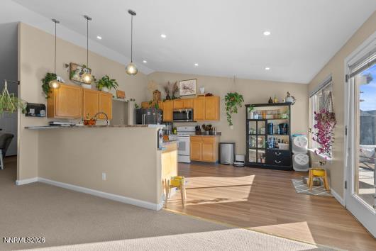 552 Spur Court Fernley, NV 89408 - Photo 16 of 46 a view of a living room and kitchen