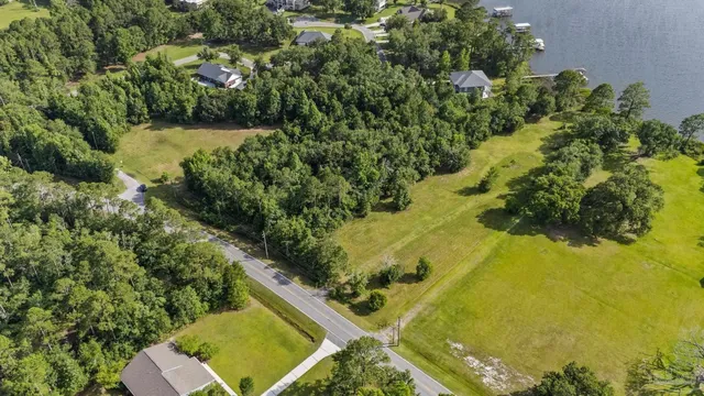 a view of a lake with a yard