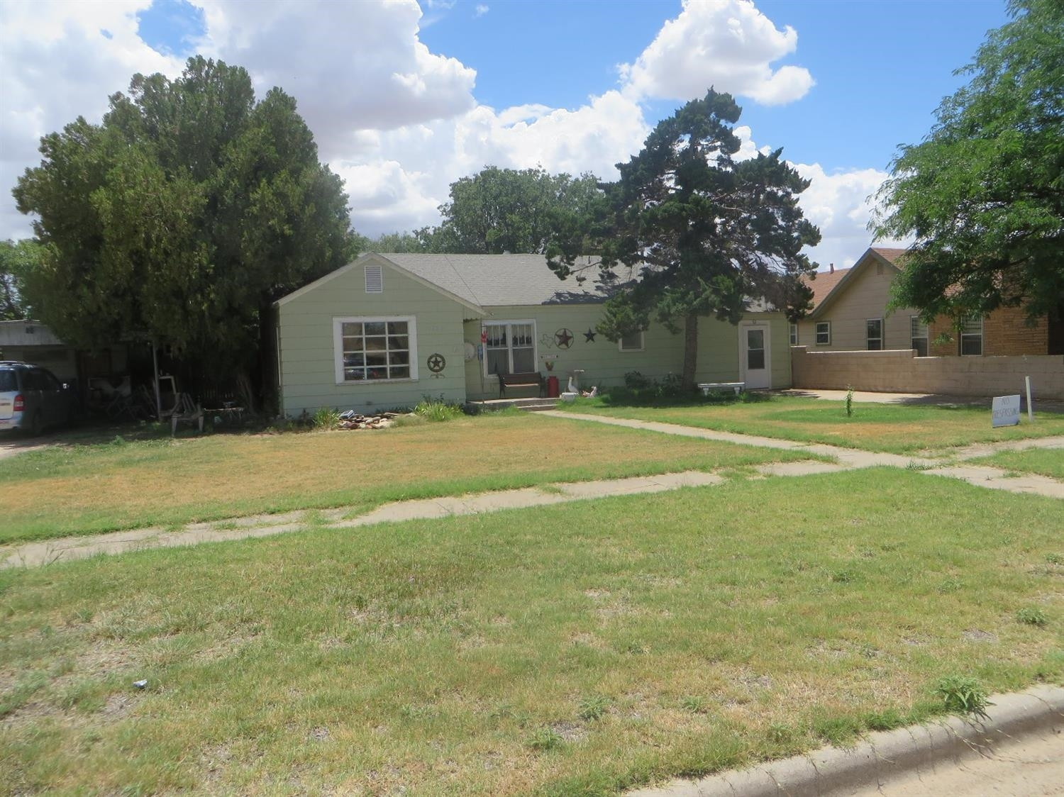 1420 Tilford Street Ralls, TX 79357 - Photo 1 of 7 a house view with swimming pool in front of it