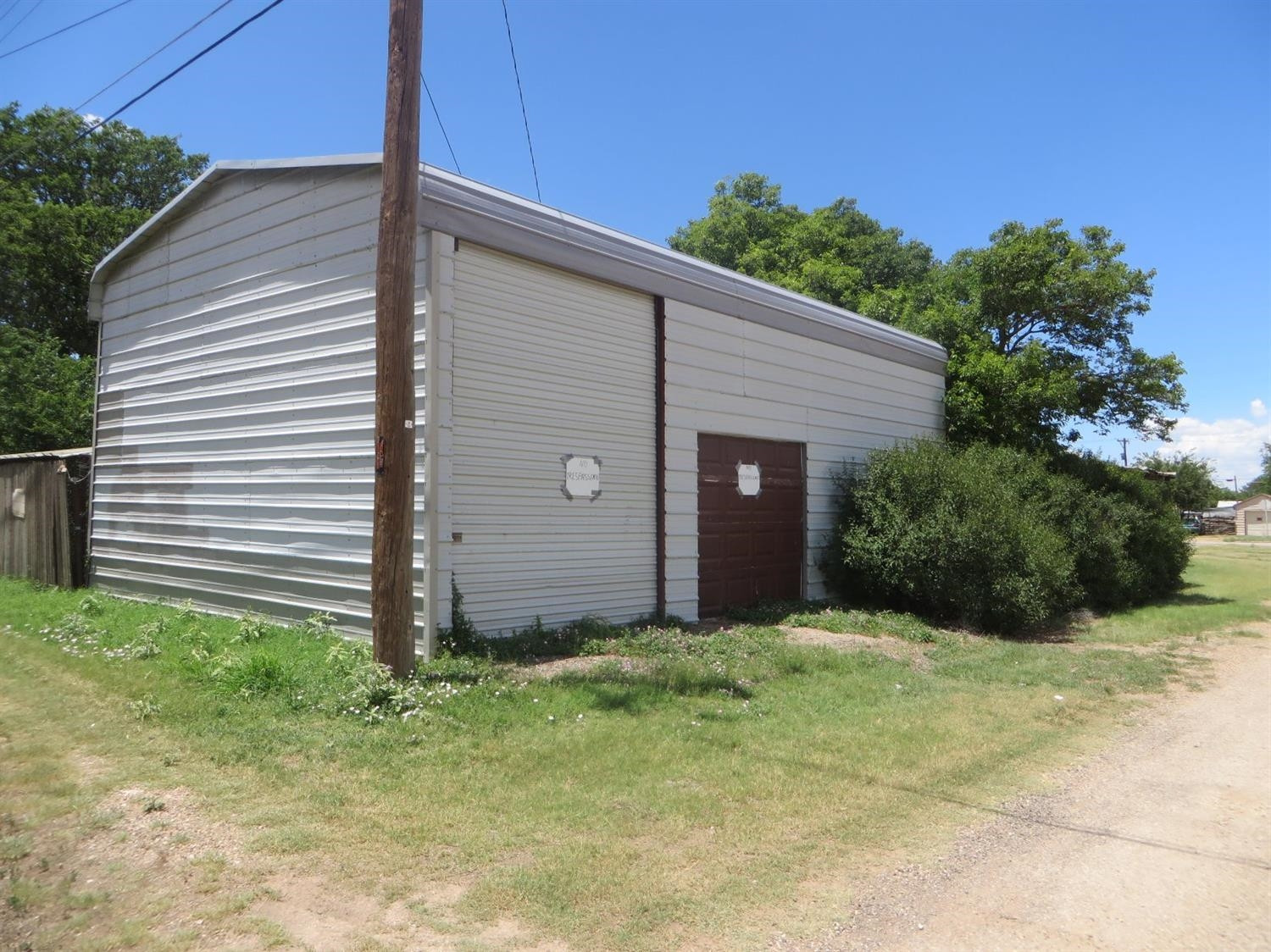 1420 Tilford Street Ralls, TX 79357 - Photo 2 of 7 a front view of a house with a yard