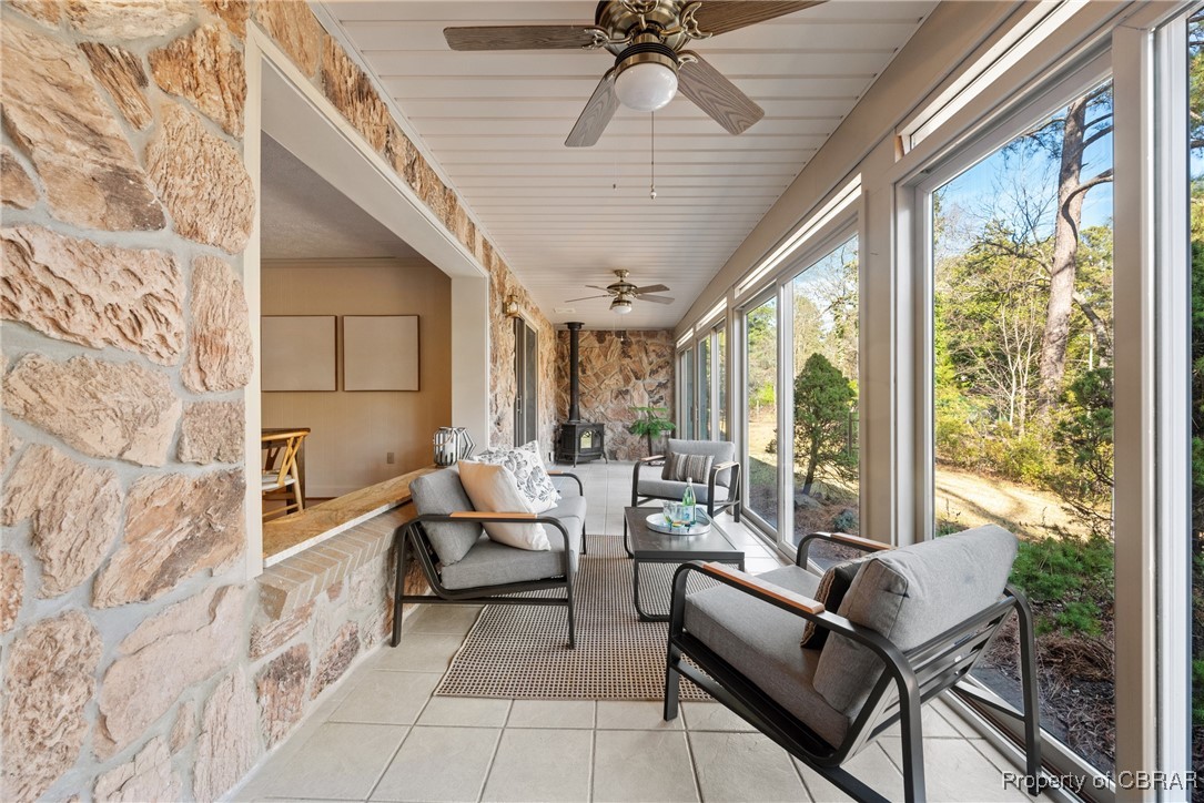 118 Paradise Point Road Yorktown, VA 23692 - Photo 17 of 50 Sunroom / solarium with a wood stove and ceiling fan
