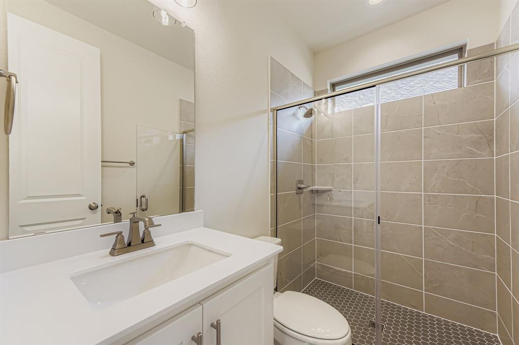 130 Pecan Lane Rhome, TX 76078 - Photo 19 of 28 Full bathroom with vanity and a shower stall
