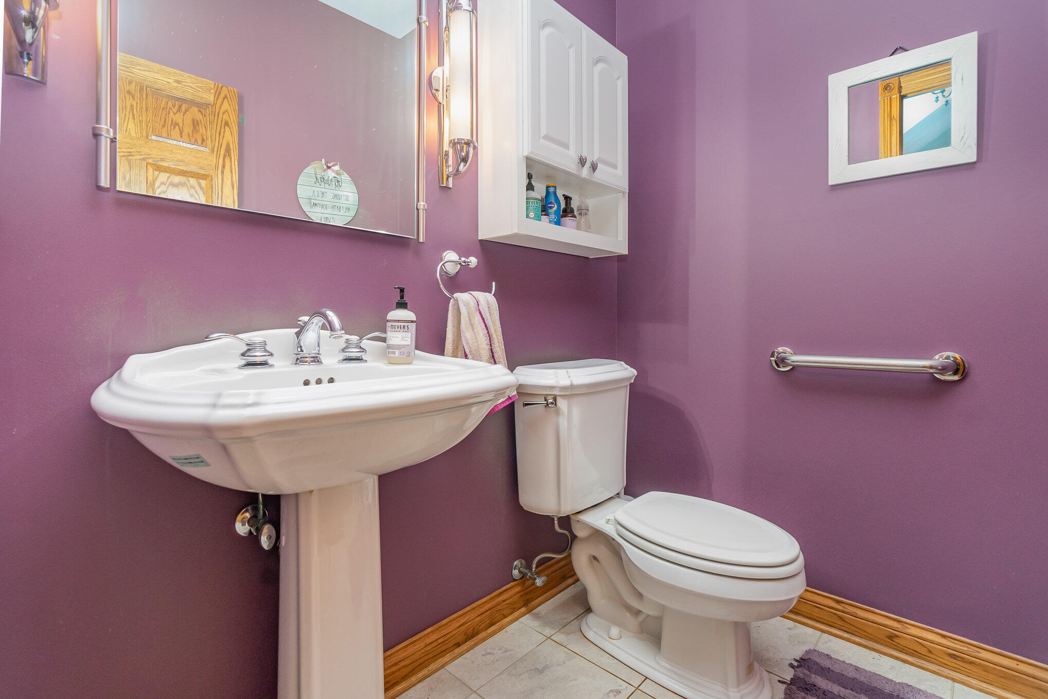 8855 East 93rd Avenue Crown Point, IN 46307 - Photo 14 of 41 a bathroom with a sink mirror and toilet