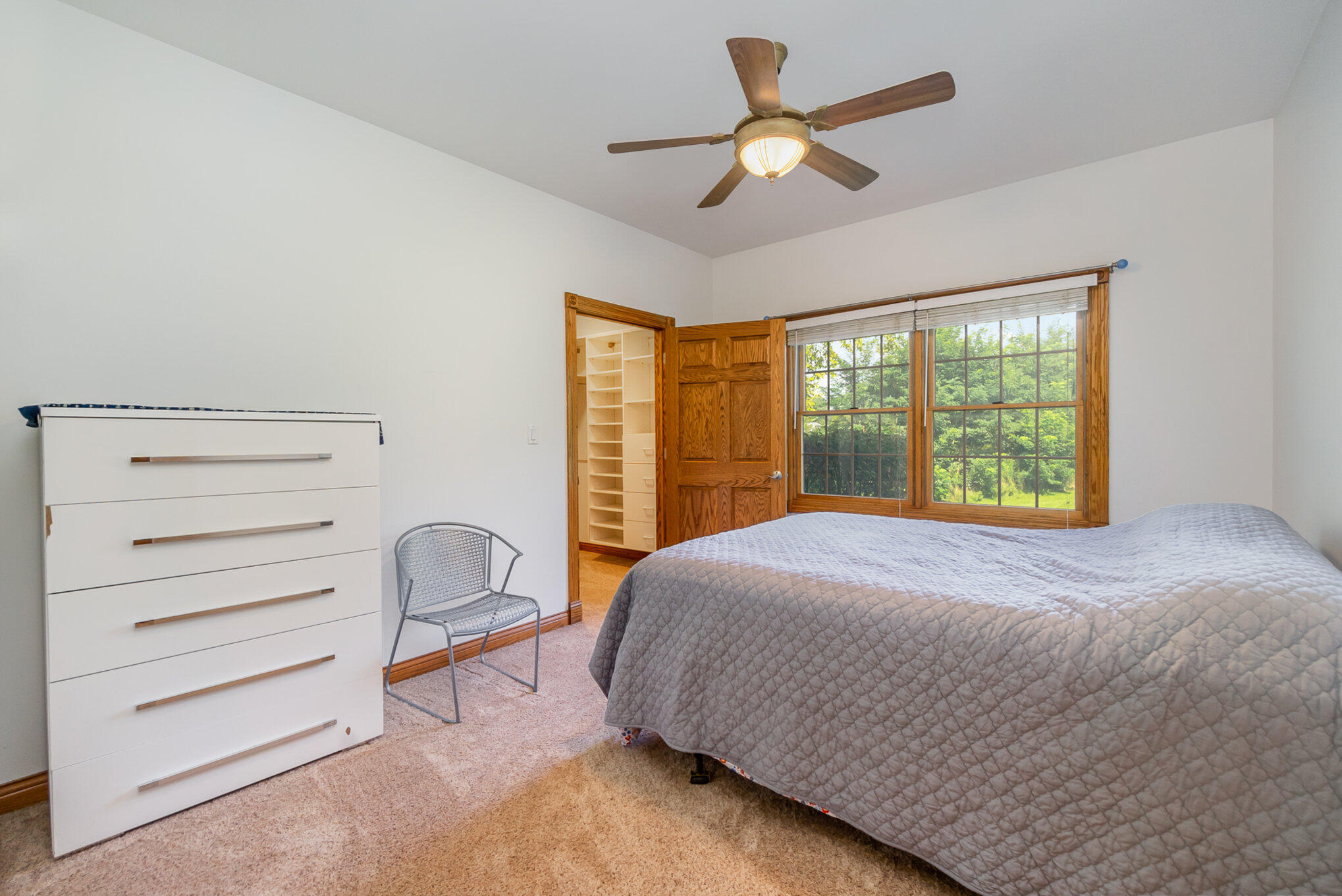 8855 East 93rd Avenue Crown Point, IN 46307 - Photo 17 of 41 a bedroom with a bed and wooden floor