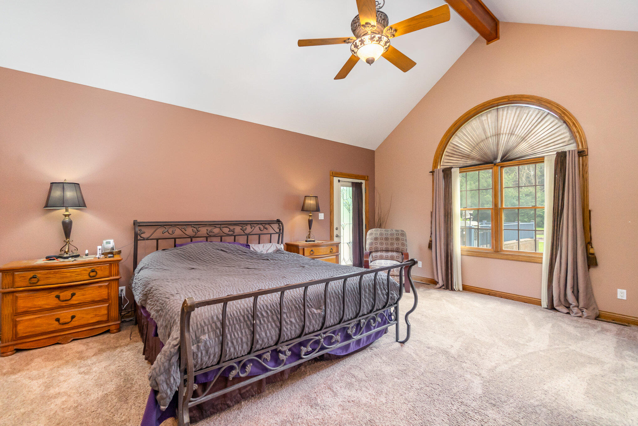 8855 East 93rd Avenue Crown Point, IN 46307 - Photo 19 of 41 a bedroom with a bed a dresser and mirror
