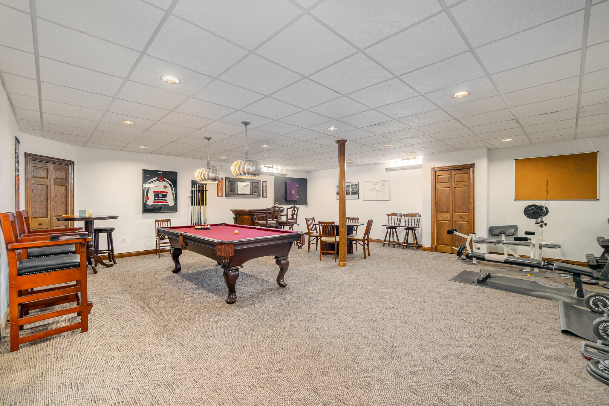 8855 East 93rd Avenue Crown Point, IN 46307 - Photo 23 of 41 a living room with furniture and a flat screen tv
