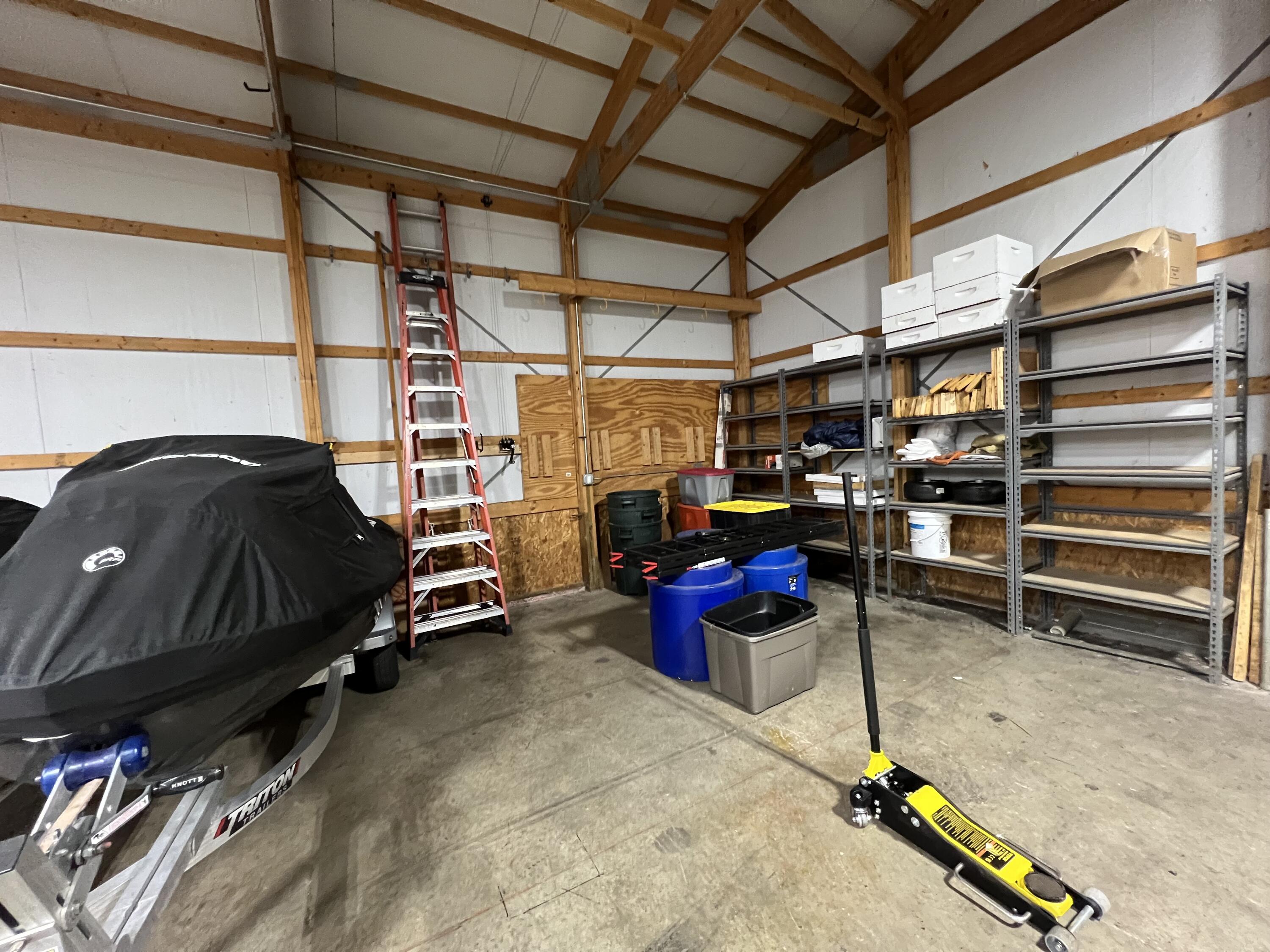 8855 East 93rd Avenue Crown Point, IN 46307 - Photo 39 of 41 a garage with a car parked car