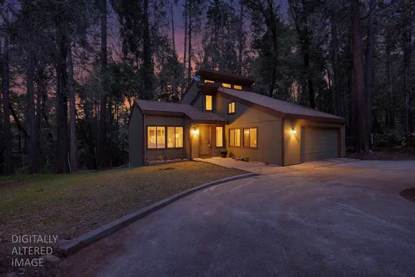a view of a house with a yard