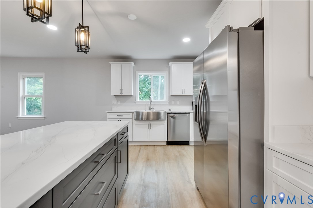 7906 Battlefield Park Road Henrico, VA 23231 - Photo 15 of 42 a kitchen with stainless steel appliances a refrigerator sink and stove
