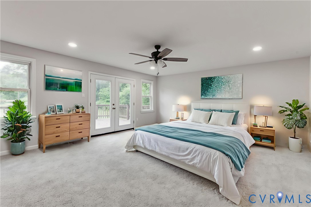 7906 Battlefield Park Road Henrico, VA 23231 - Photo 21 of 42 a spacious bedroom with a bed and a potted plant