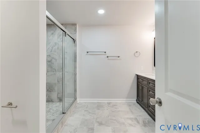 a bathroom with a shower toilet and sink