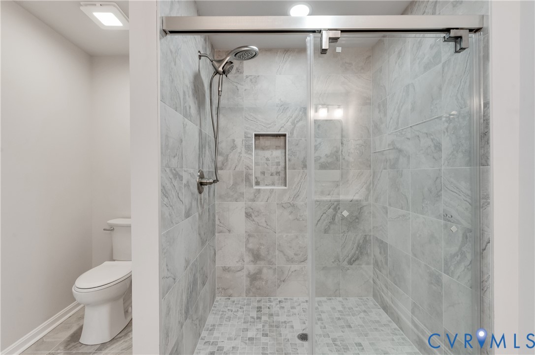 7906 Battlefield Park Road Henrico, VA 23231 - Photo 25 of 42 a bathroom with a shower toilet and sink