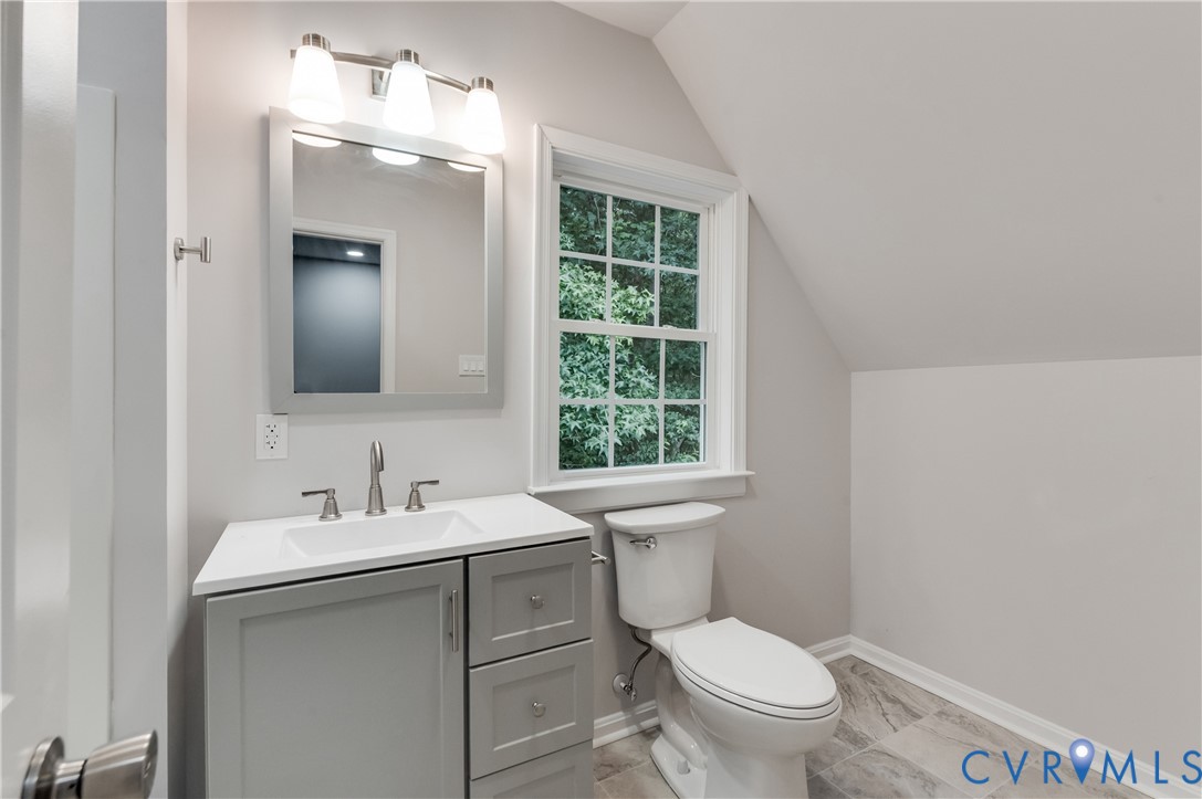 7906 Battlefield Park Road Henrico, VA 23231 - Photo 29 of 42 a bathroom with a toilet sink and mirror