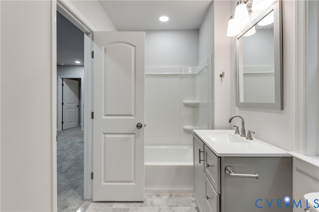 7906 Battlefield Park Road Henrico, VA 23231 - Photo 30 of 42 a bathroom with a sink and a mirror