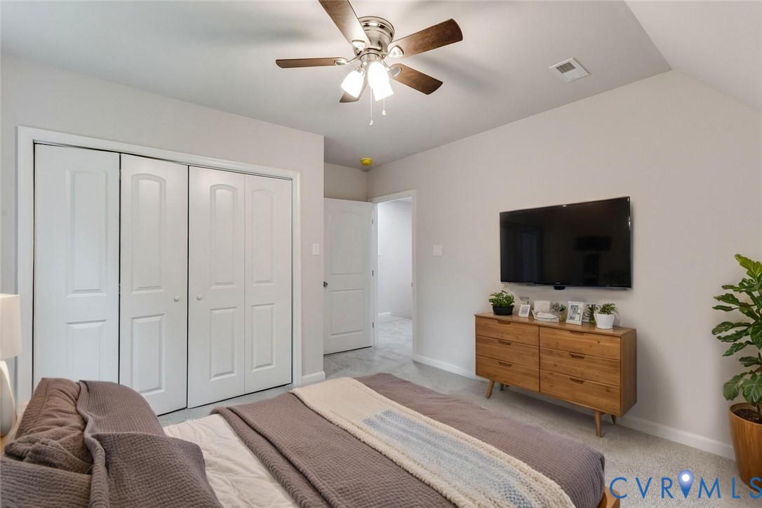 7906 Battlefield Park Road Henrico, VA 23231 - Photo 31 of 42 a bedroom with a bed and a flat screen tv