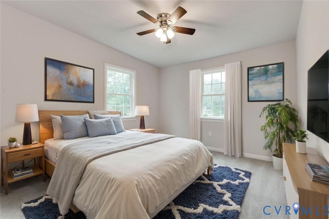 7906 Battlefield Park Road Henrico, VA 23231 - Photo 35 of 42 a bedroom with a bed and a potted plant