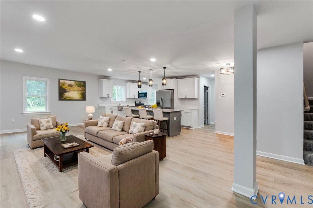 7906 Battlefield Park Road Henrico, VA 23231 - Photo 10 of 42 a living room with furniture and a wooden floor