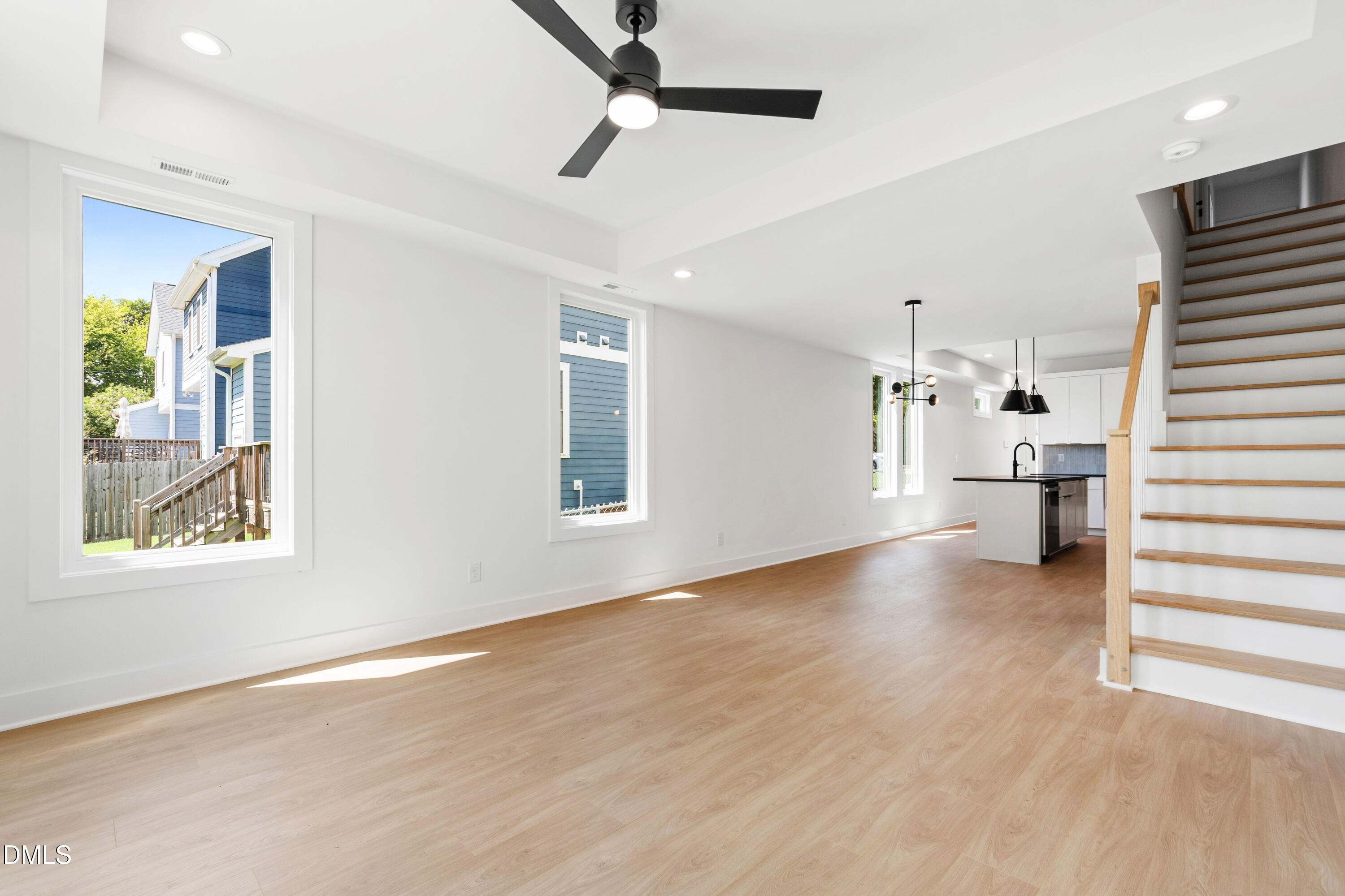 1508 Boyer Street Raleigh, NC 27610 - Photo 23 of 52 a view of empty room with wooden floor and windows