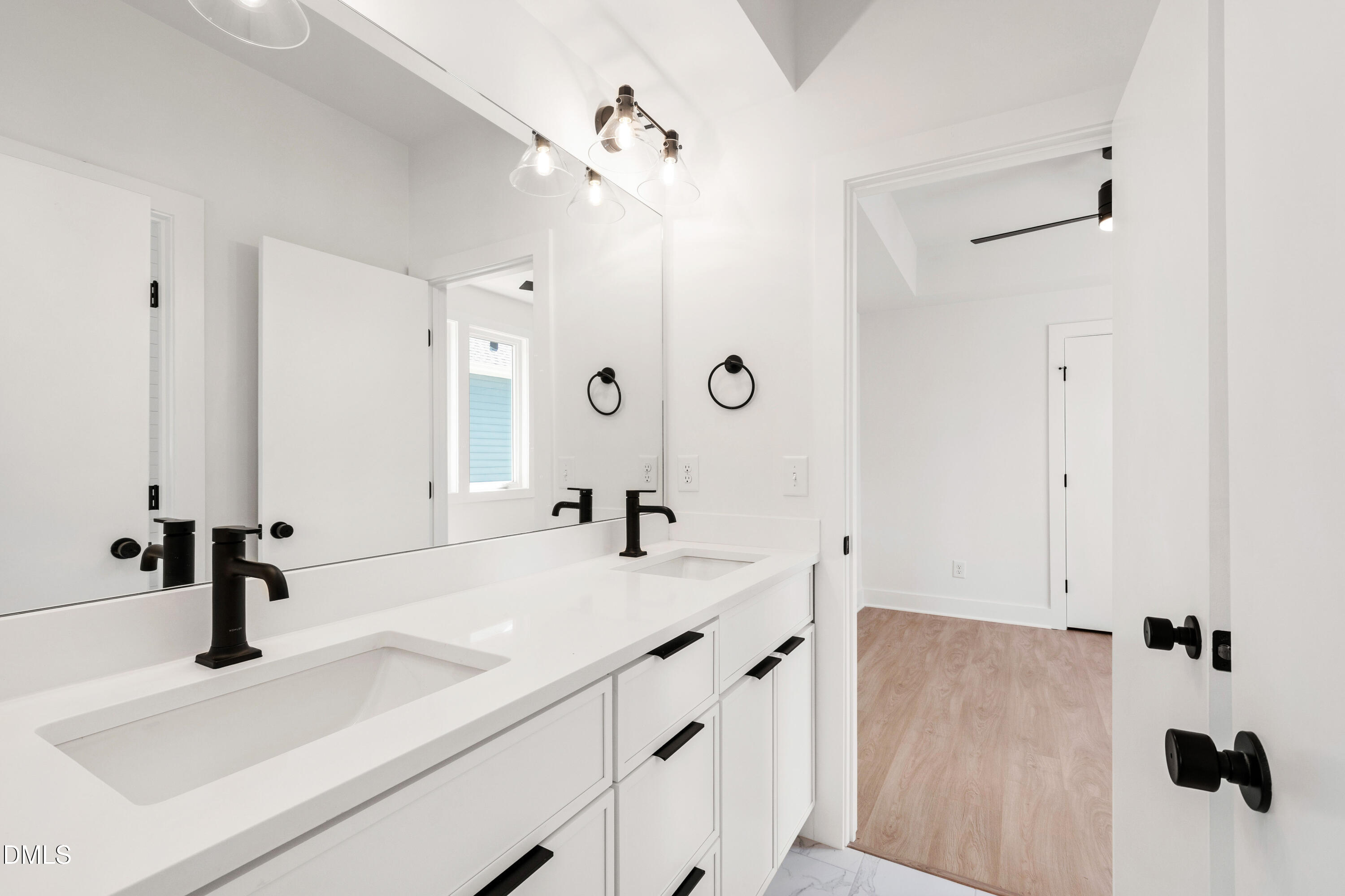 1508 Boyer Street Raleigh, NC 27610 - Photo 29 of 52 a bathroom with a sink and a mirror