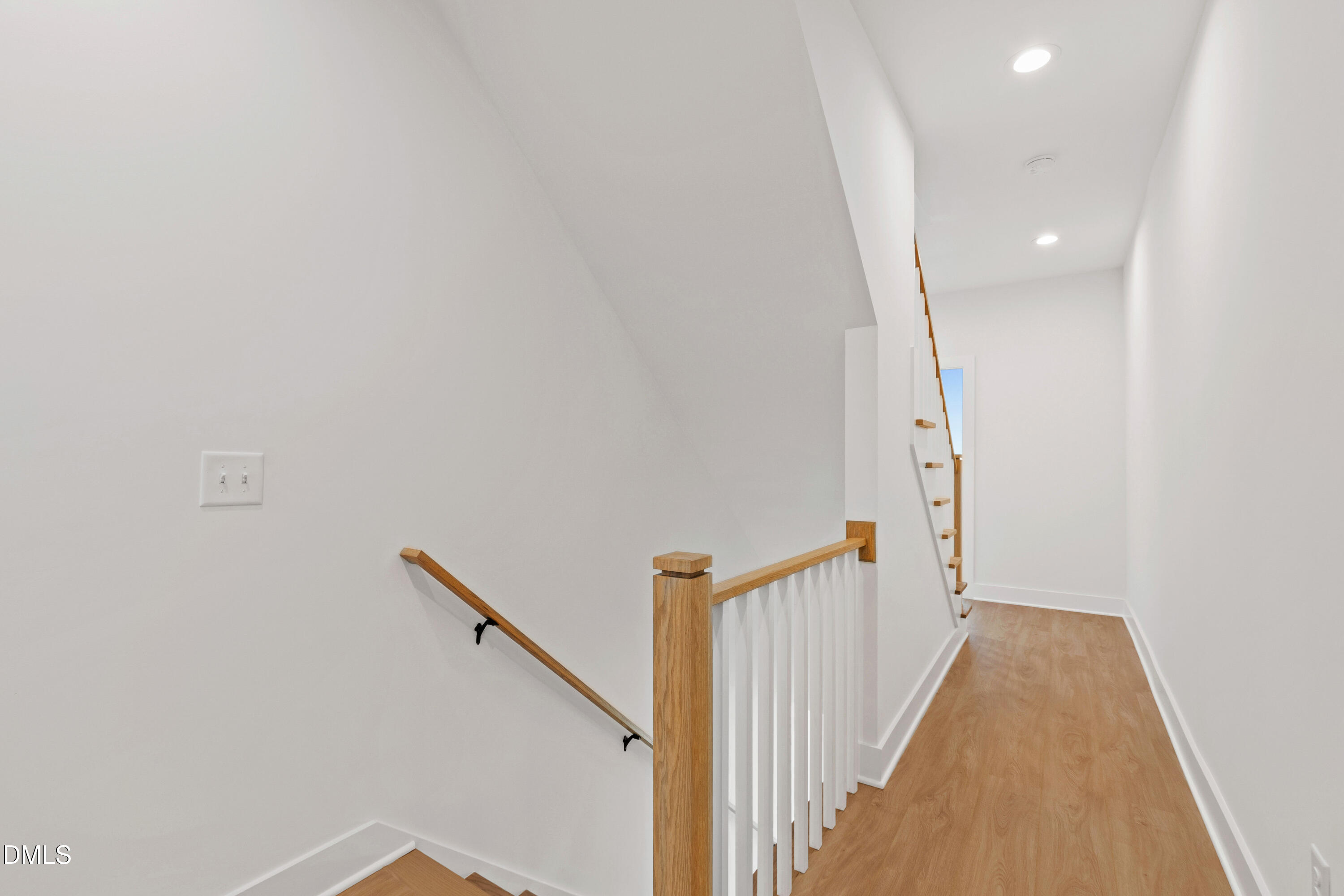 1508 Boyer Street Raleigh, NC 27610 - Photo 34 of 52 a view of a hallway with wooden floor and entryway