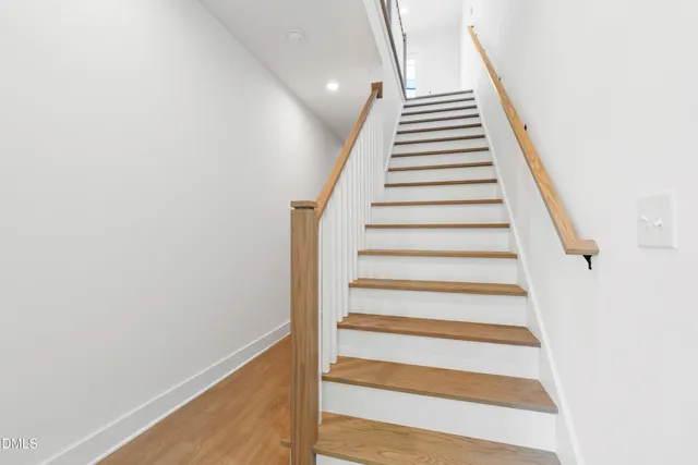 a bathroom with a sink and a mirror with bathtub