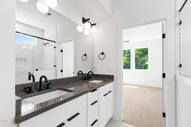 a view of a kitchen with a sink and cabinet area