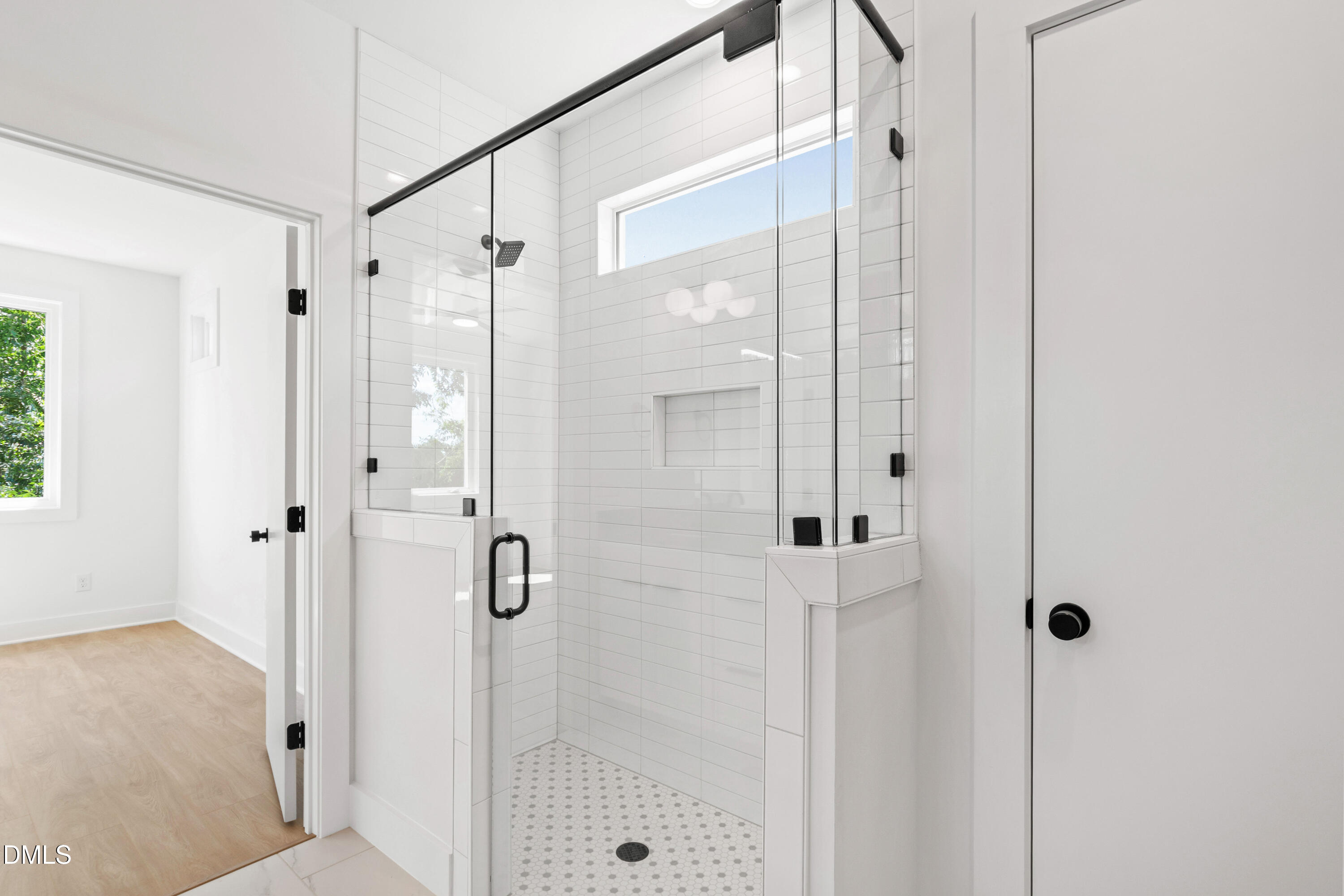 1508 Boyer Street Raleigh, NC 27610 - Photo 39 of 52 a bathroom with a glass shower door