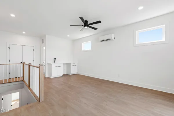 a utility room with sink dryer and washer