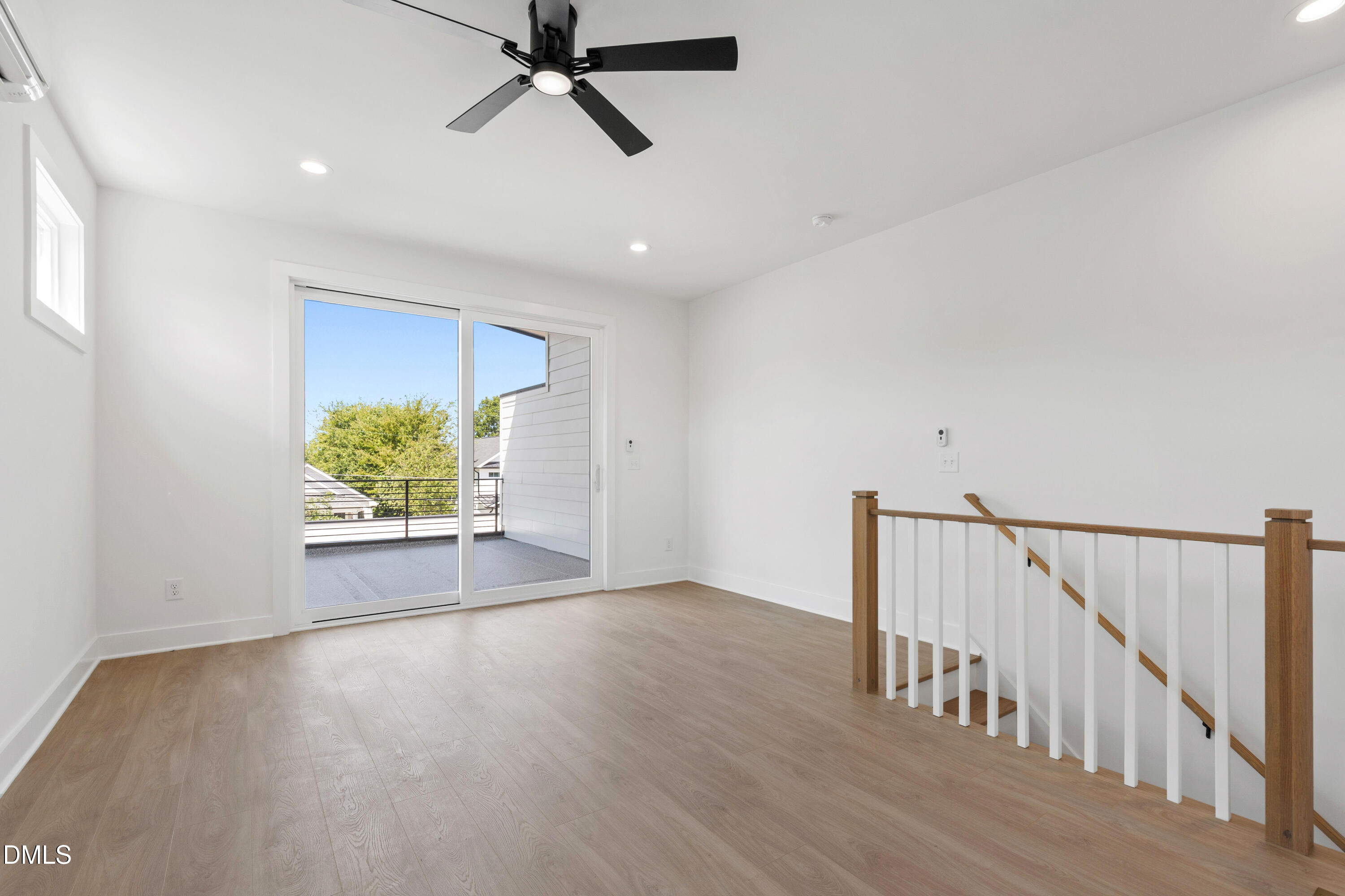 1508 Boyer Street Raleigh, NC 27610 - Photo 43 of 52 a view of an empty room with wooden floor and a window
