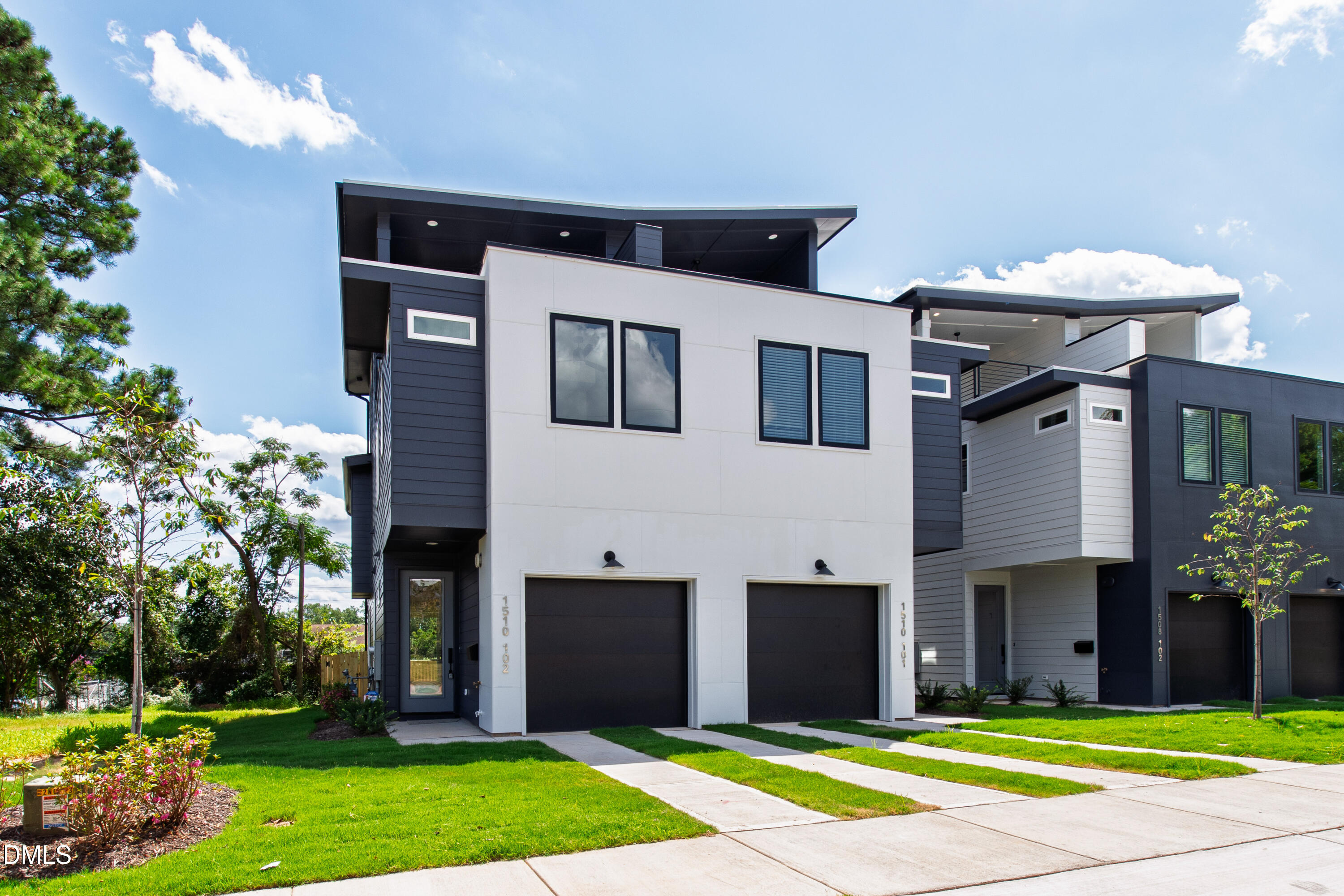 1508 Boyer Street Raleigh, NC 27610 - Photo 9 of 52 a front view of a house with a yard and garage