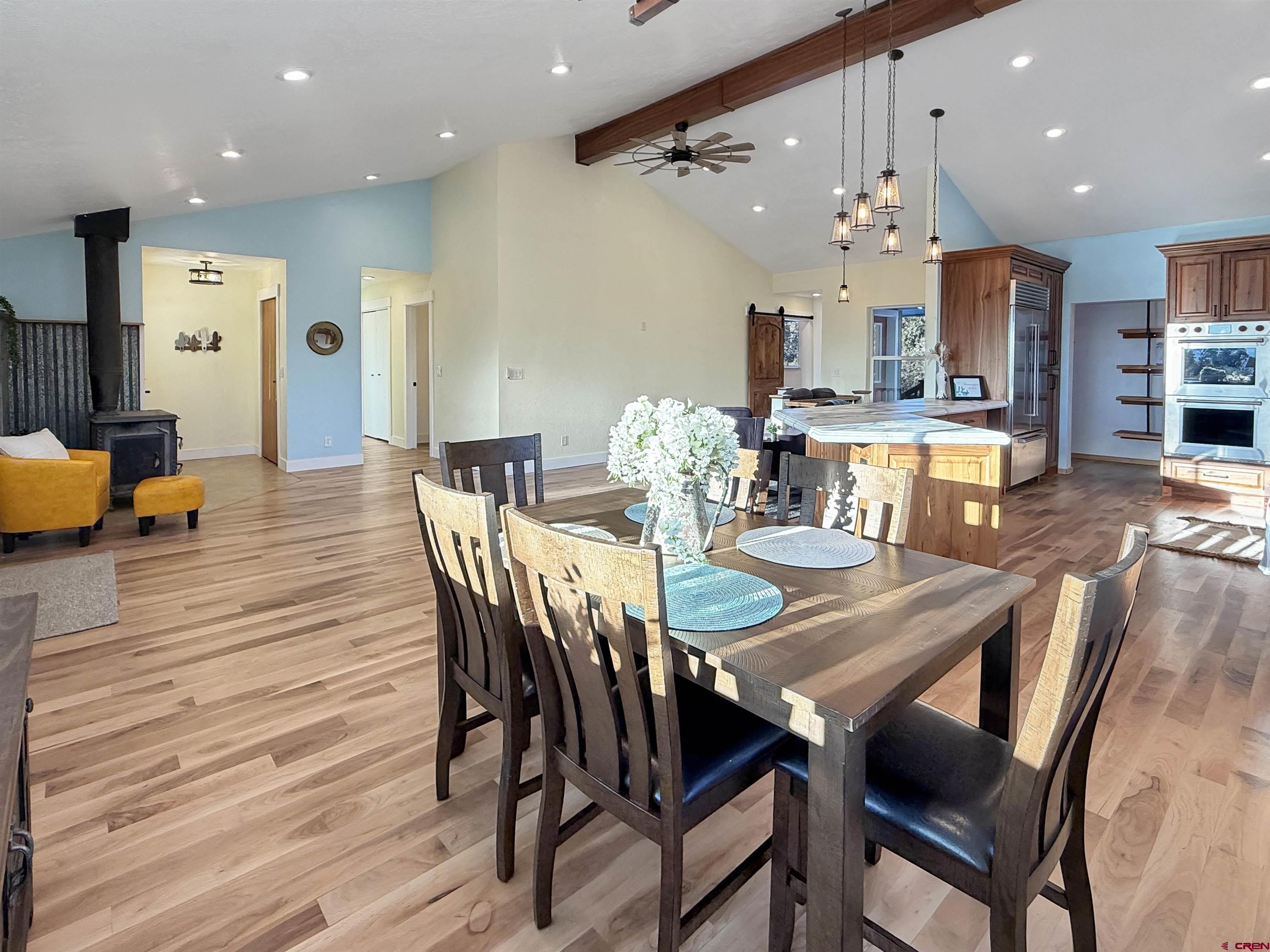 27425 Rd P.7 Dolores, CO 81323 - Photo 13 of 45 a view of a dining room with furniture and wooden floor