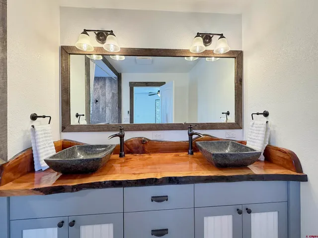 a bathroom with sink and mirror