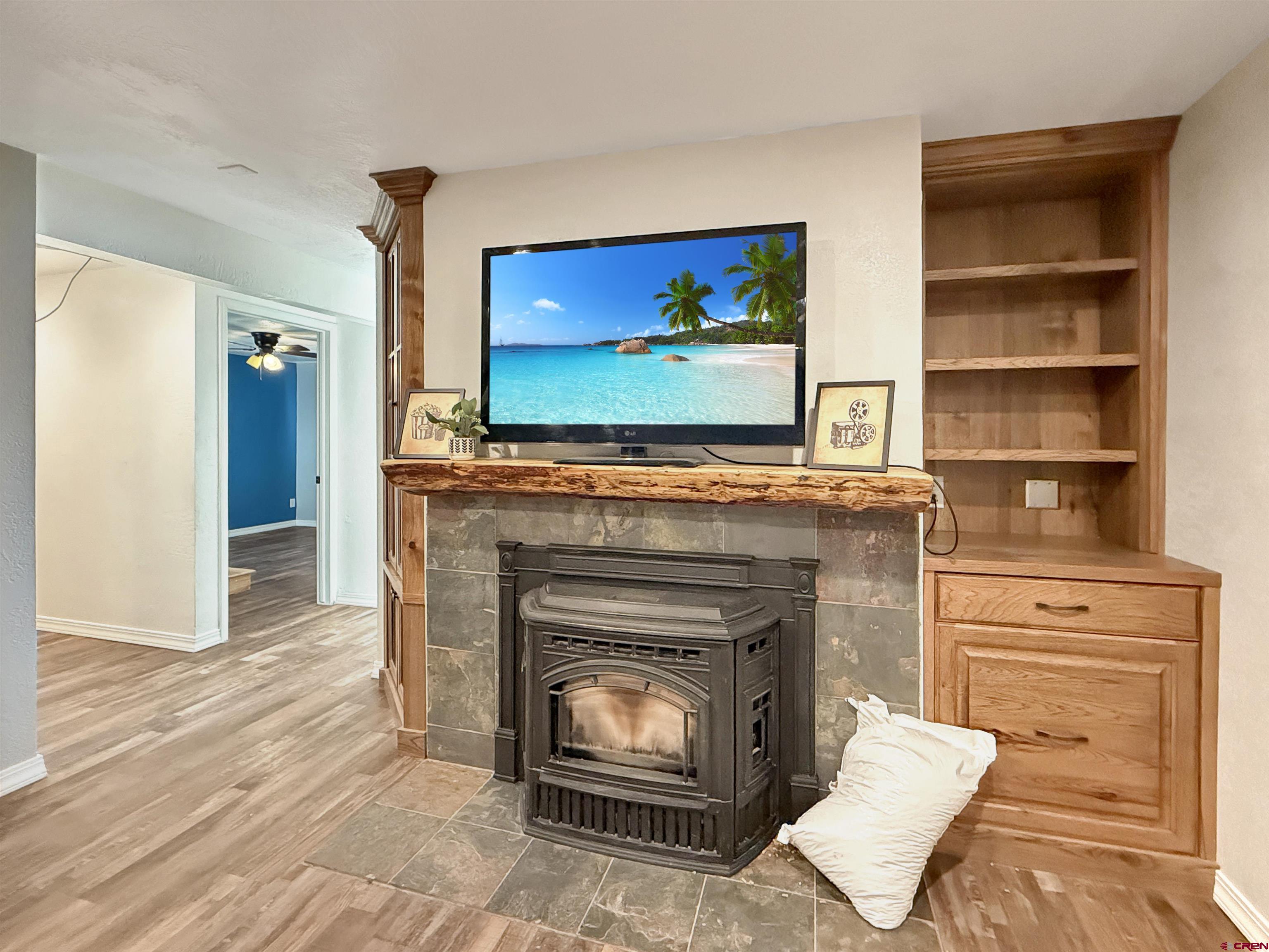 27425 Rd P.7 Dolores, CO 81323 - Photo 27 of 45 a living room with a fireplace and a flat screen tv