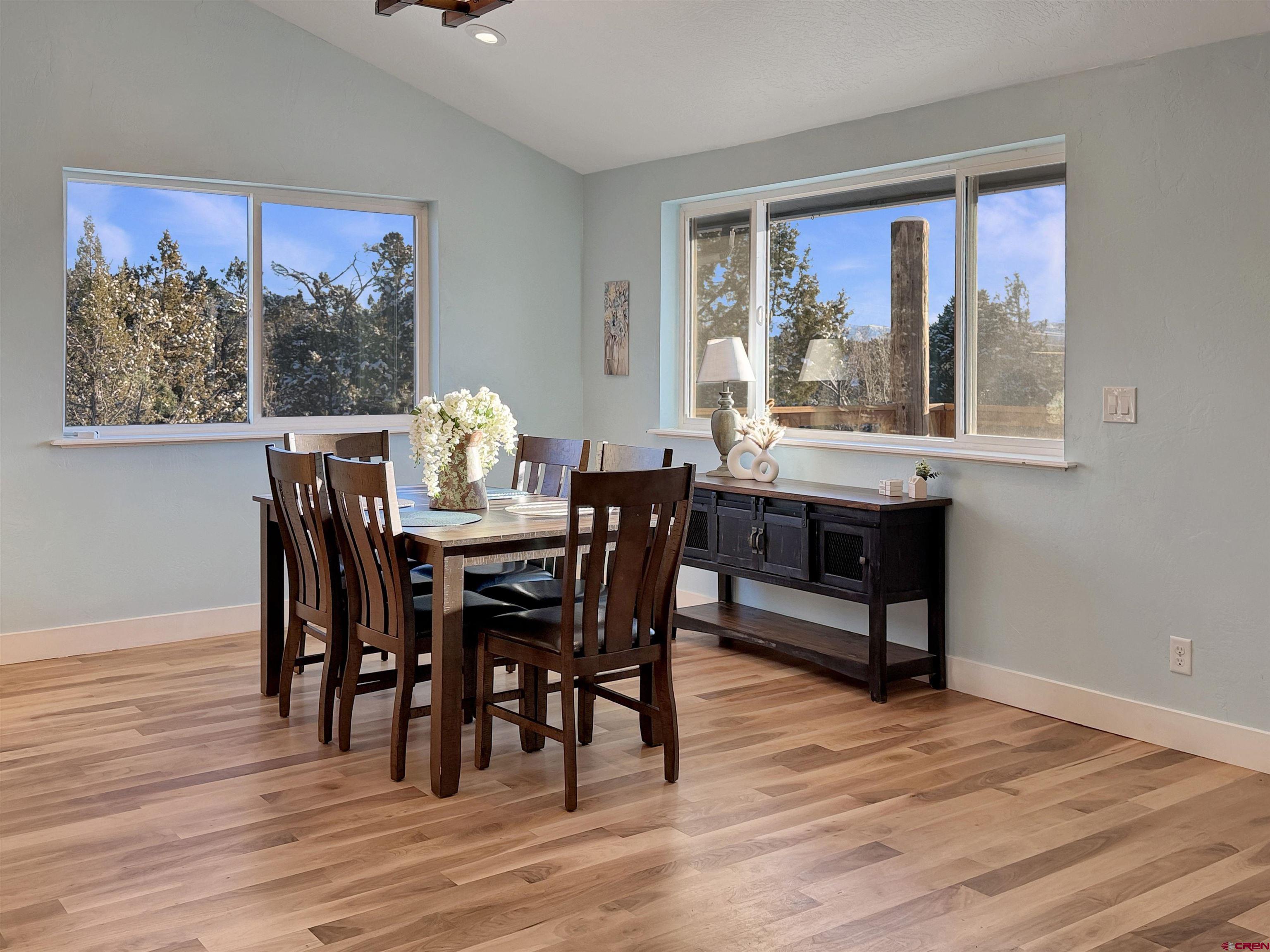 27425 Rd P.7 Dolores, CO 81323 - Photo 3 of 45 a dining room with furniture a rug and wooden floor