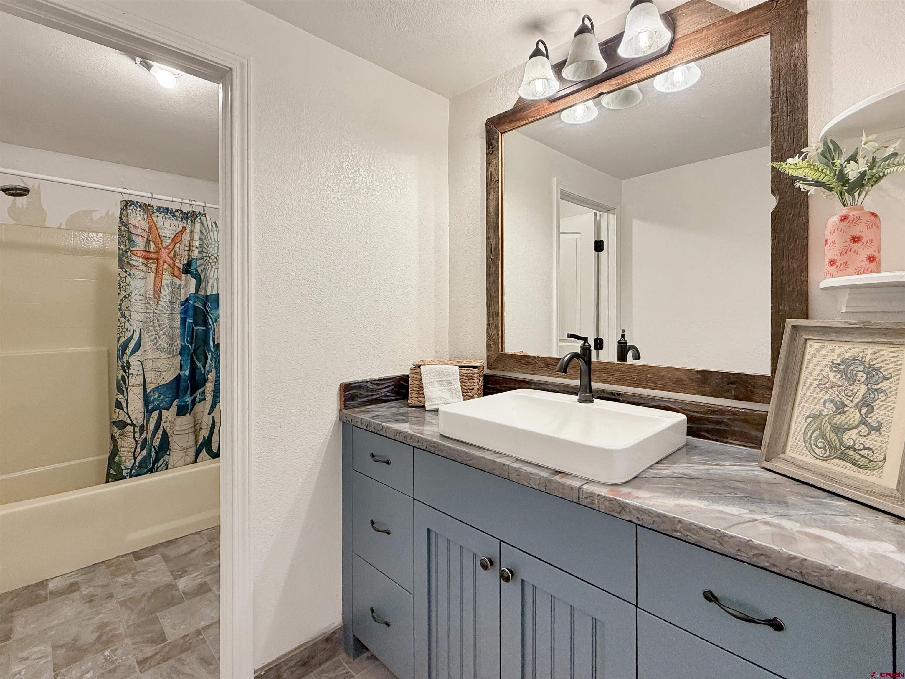 27425 Rd P.7 Dolores, CO 81323 - Photo 31 of 45 a bathroom with a sink and a mirror
